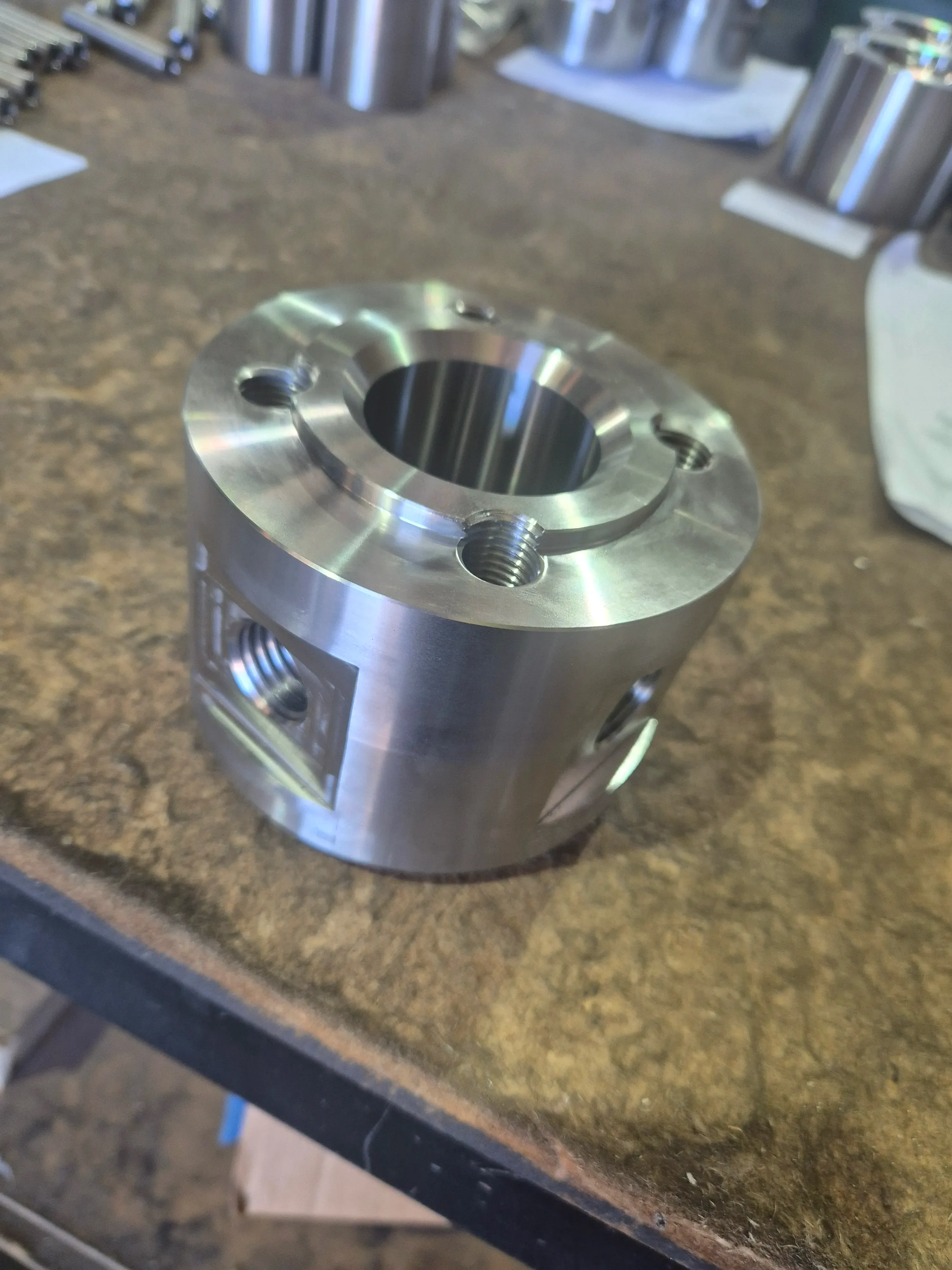 Stainless steel flanged collar with threaded ports