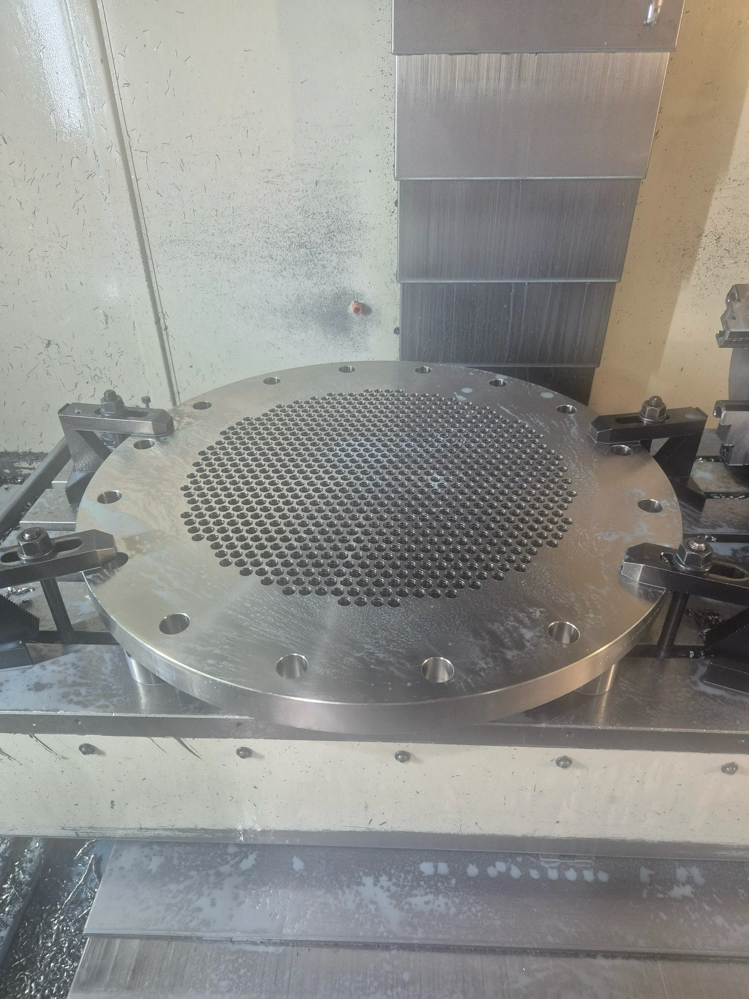 Drilled tube sheet clamped in the machining centre